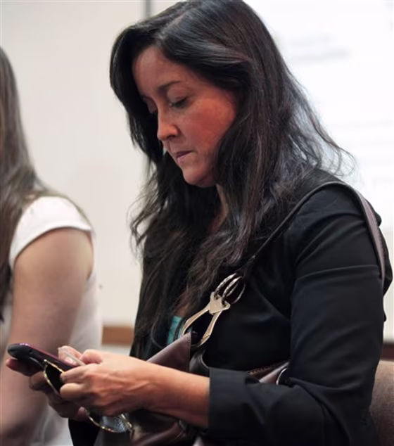 Activist Rocio San Miguel, who leads a private organization focused on national security and defense issues, uses her&nbsp;BlackBerry in Caracas, Venezuela, on Sept. 11. Venezuela's political battle is playing out&nbsp;on Twitter, where the accounts of&nbsp;critics of President Hugo Chavez, San Miguel's included, have been&nbsp;hacked. 